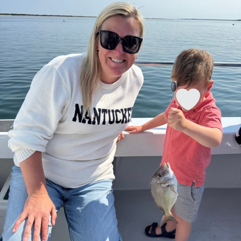 Critter Cruise fishing mom and son with fish