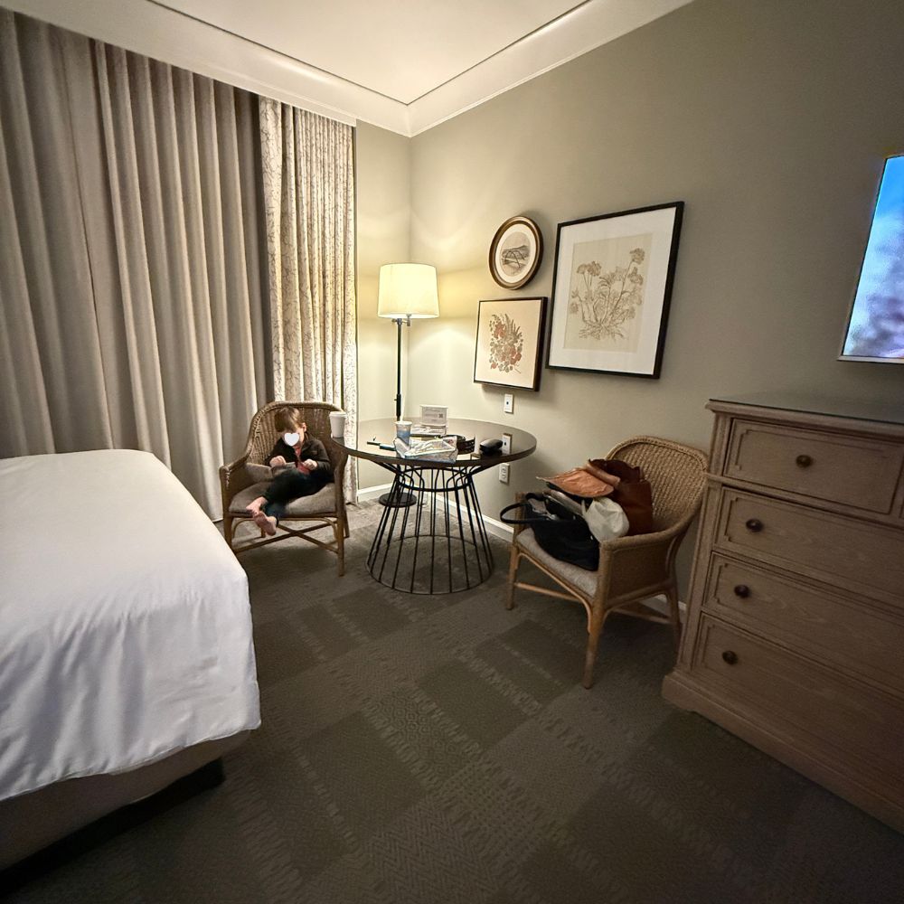 View of hotel room, bed and seating area at Omni Barton Creek Resort in Austin Texas