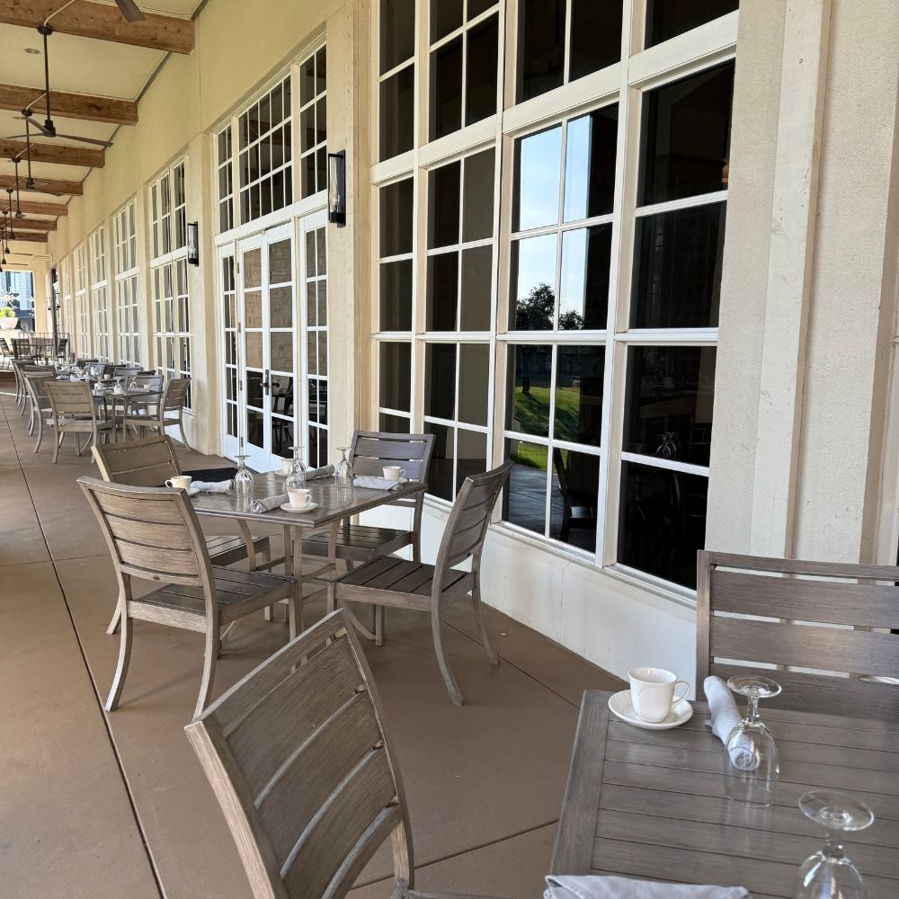 Tables and chairs on outdoor patio at Omni Barton Creek Resort and Spa in Austin Texas