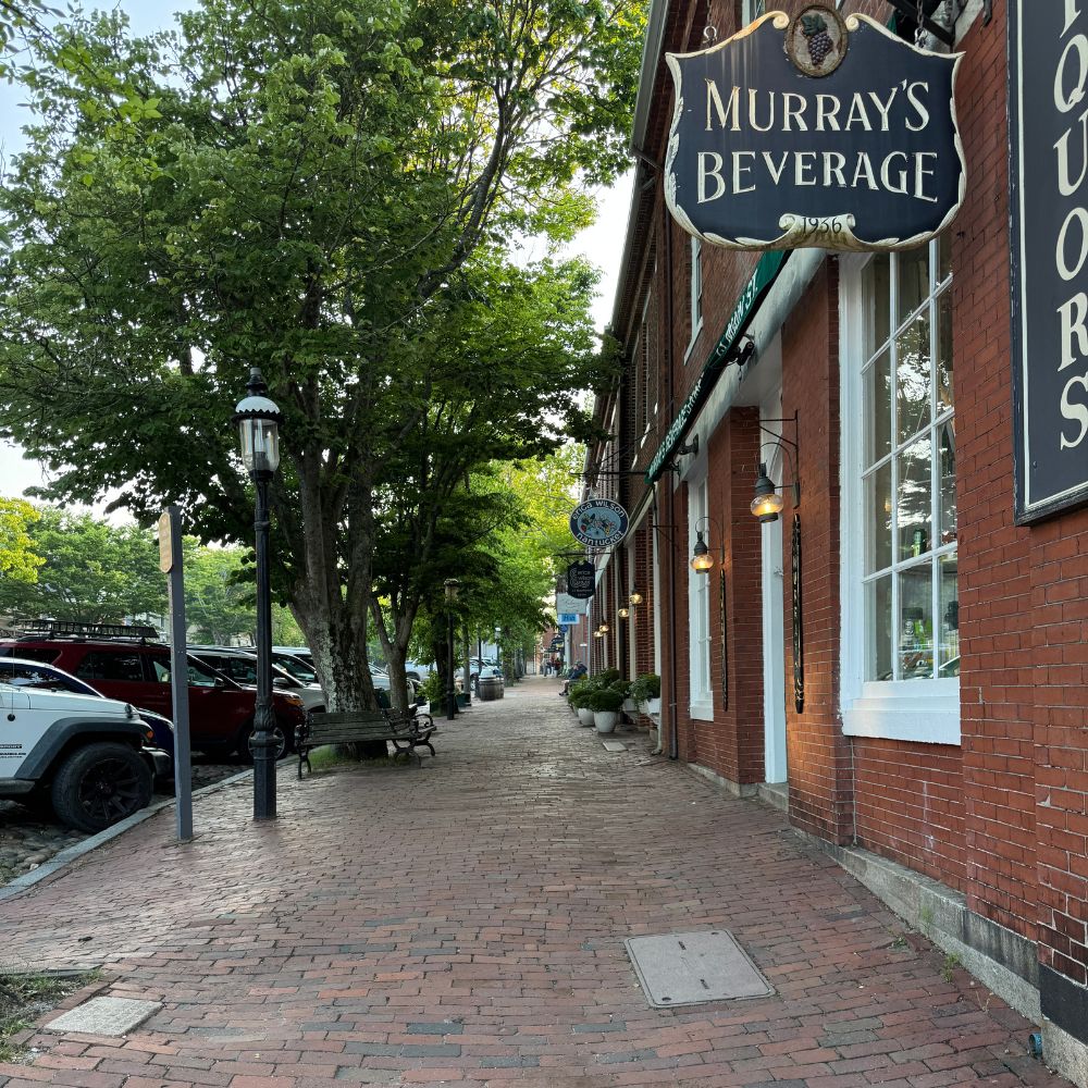 Murray's Beverage sign hanging overside walk in Town Nantucket