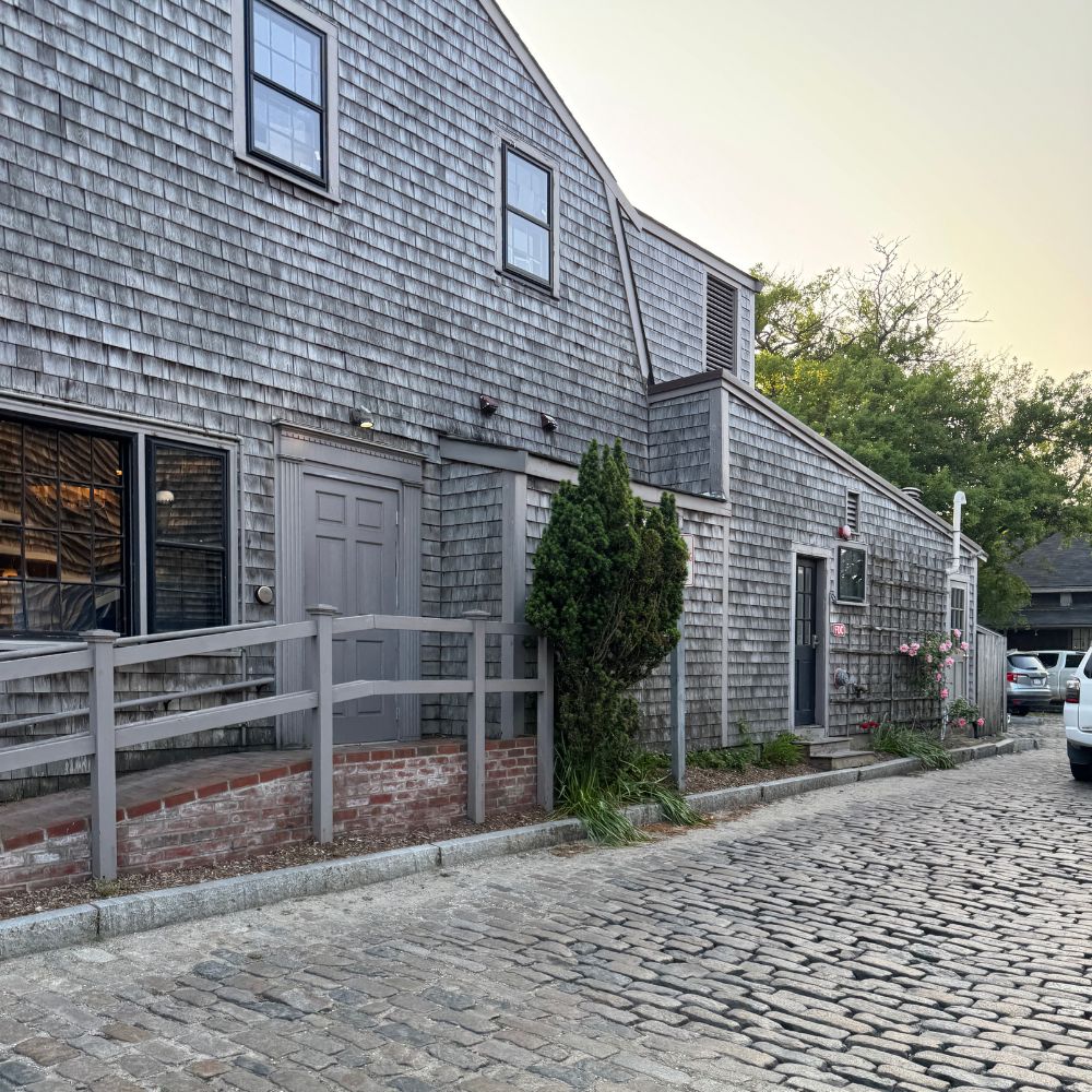 Gray shingle building with sunset in background Nantucket Massachusetts