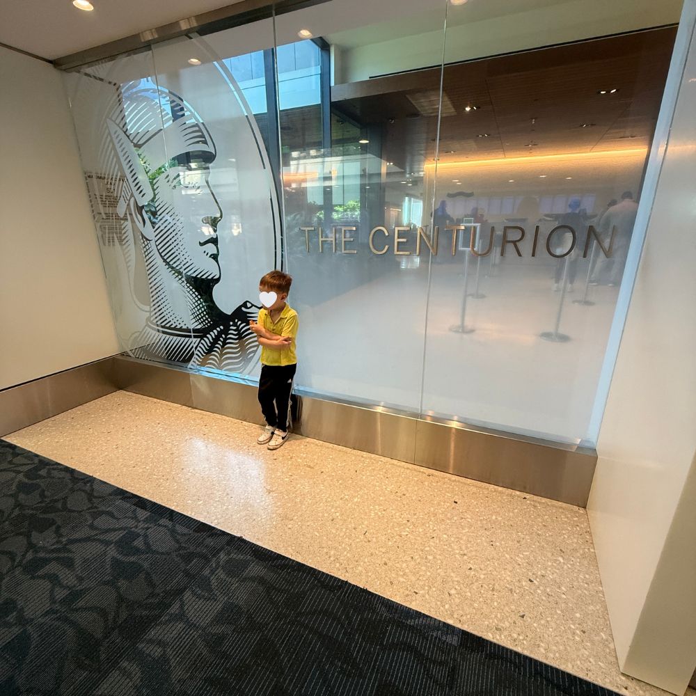 child standing in front of ATL Centurion Lounge