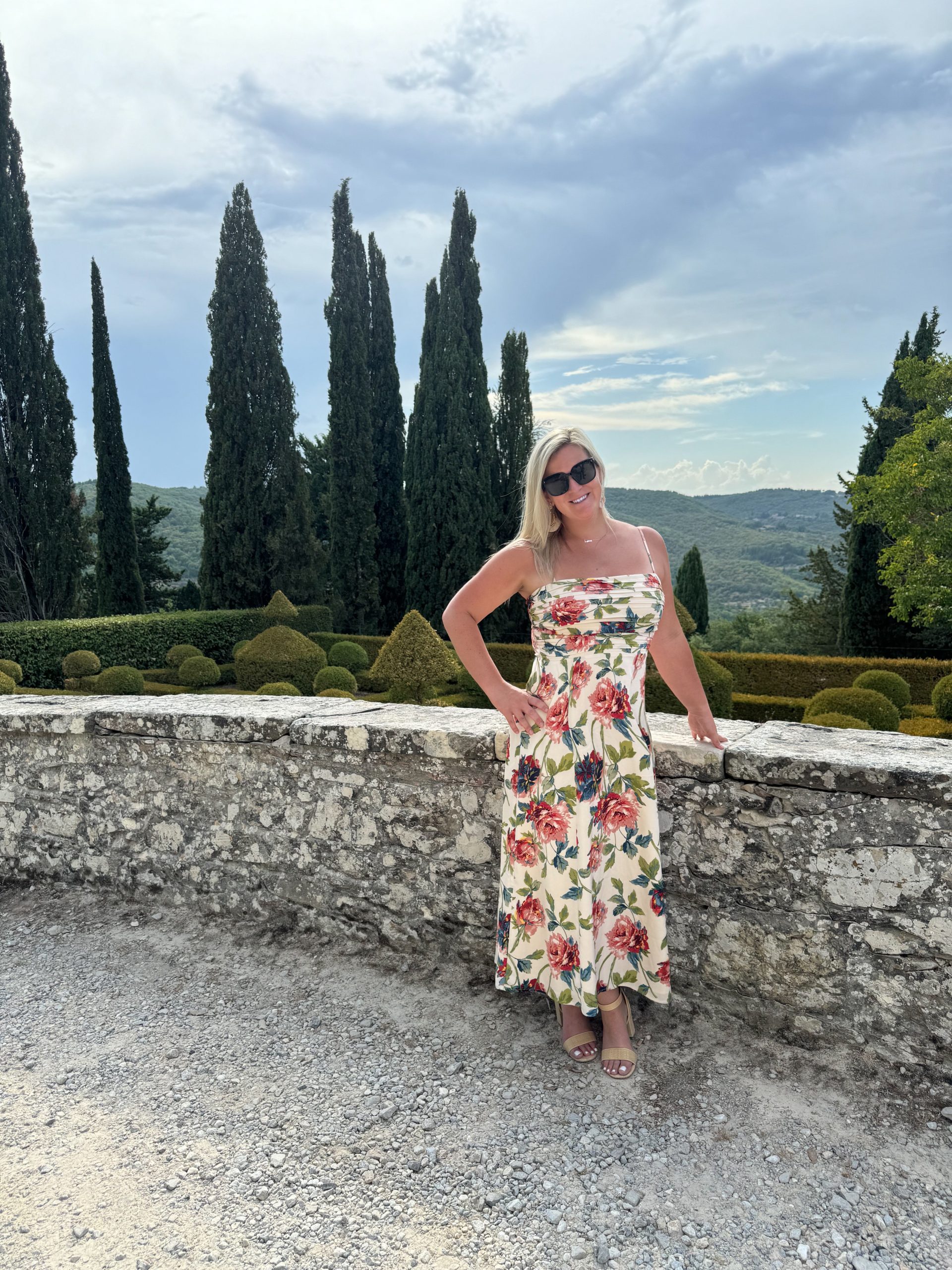 woman in Tuscany Italy Italian Cyprus trees in the distance