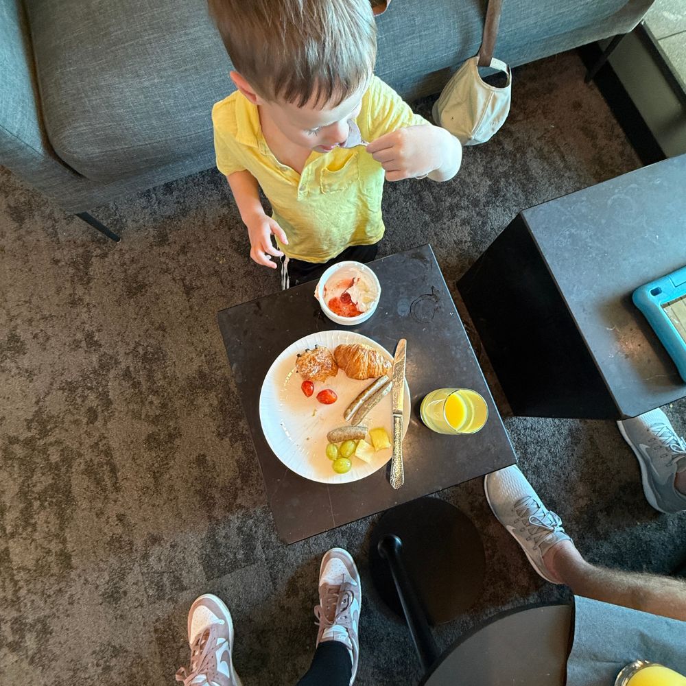child eating breakfast in ATL Centurion Lounge