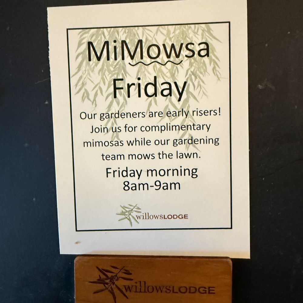 Sign reading Mimosa Friday, information and hours at Willows Lodge