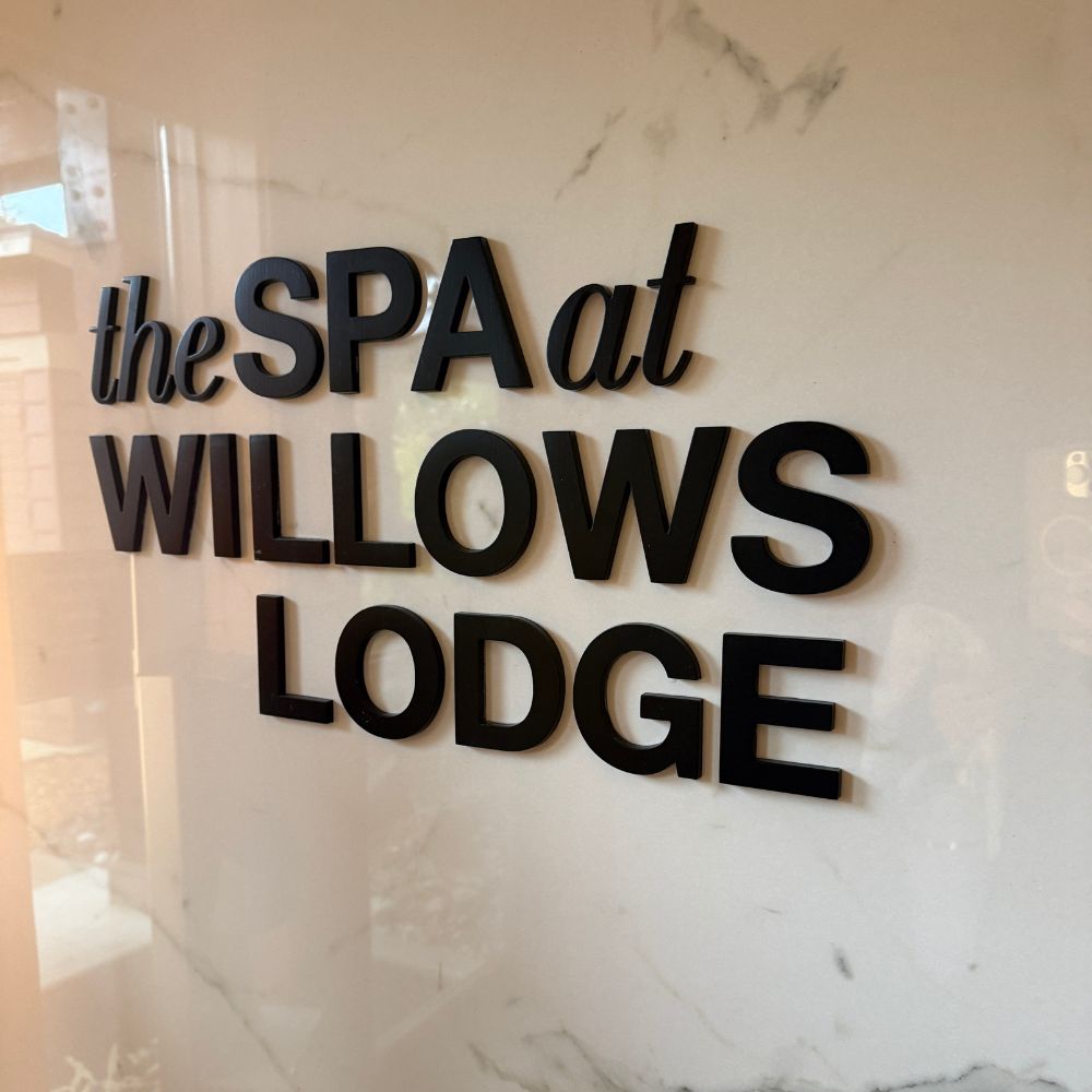 The Spa at Willows Lodge sign on marble wall